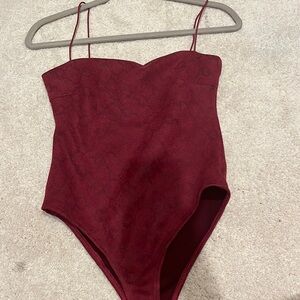 small red bodysuit